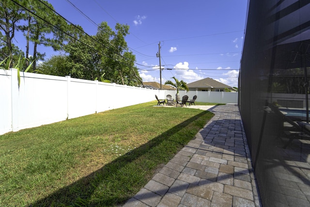 view of yard with a patio area and a fenced backyard