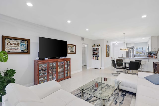 701 NE Harbour Ter Unit 103, Boca Raton, FL 33431 - living room featuring recessed lighting, baseboards, and a chandelier