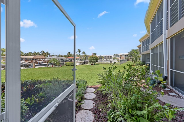 701 NE Harbour Ter Unit 103, Boca Raton, FL 33431 - view of green lawn with a residential view