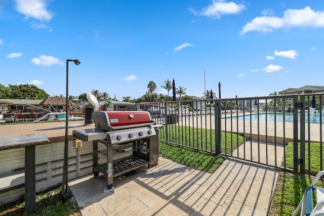 701 NE Harbour Ter Unit 103, Boca Raton, FL 33431 - view of patio / terrace featuring a community pool