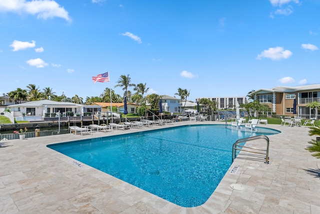 701 NE Harbour Ter Unit 103, Boca Raton, FL 33431 - community pool with a patio and a residential view