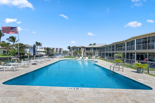 701 NE Harbour Ter Unit 103, Boca Raton, FL 33431 - community pool featuring a patio area and a residential view
