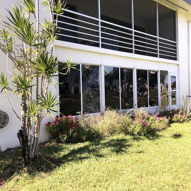 500 Piedmont K K, Delray Beach, FL 33484 - view of home's exterior featuring a lawn, stucco siding, and a balcony