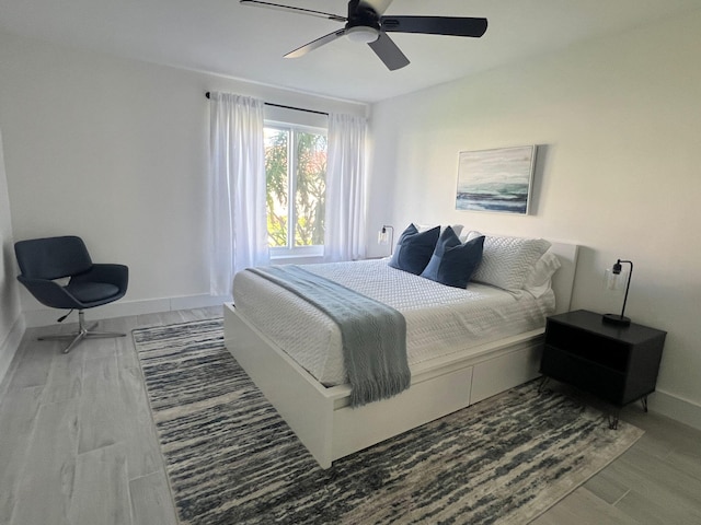 3551 Inverrary Dr Unit 203, Lauderhill, FL 33319 - bedroom with baseboards, wood finished floors, and a ceiling fan
