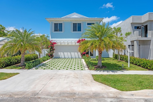 126 Auburn Dr, Lake Worth Beach, FL 33460 - view of front of property with an attached garage, concrete driveway, and a front yard