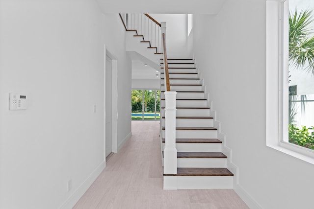 126 Auburn Dr, Lake Worth Beach, FL 33460 - stairs featuring baseboards and wood finished floors