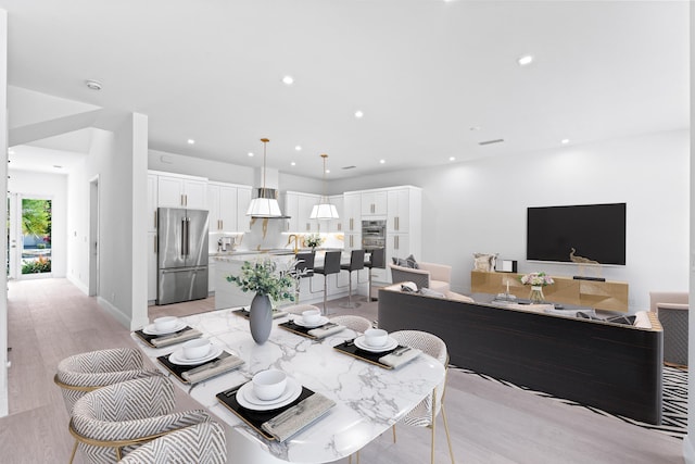 126 Auburn Dr, Lake Worth Beach, FL 33460 - dining area with light wood finished floors and recessed lighting