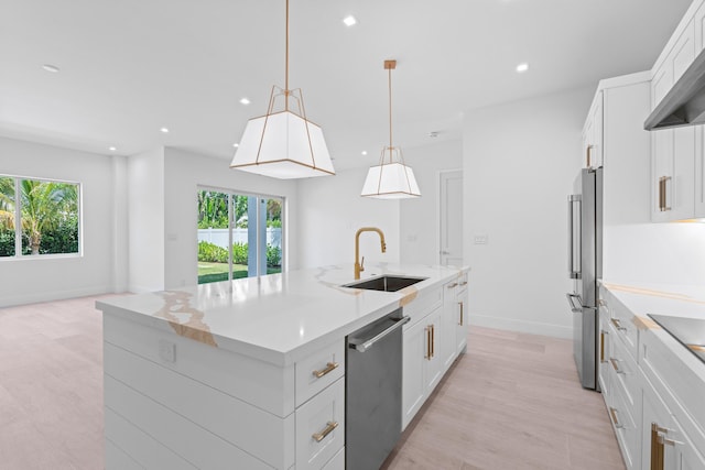 126 Auburn Dr, Lake Worth Beach, FL 33460 - kitchen featuring a kitchen island with sink, appliances with stainless steel finishes, a healthy amount of sunlight, and a sink