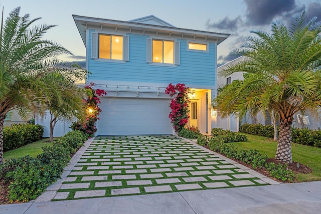 126 Auburn Dr, Lake Worth Beach, FL 33460 - view of front facade with an attached garage and concrete driveway
