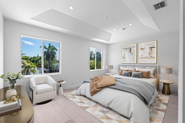 126 Auburn Dr, Lake Worth Beach, FL 33460 - bedroom featuring a tray ceiling, baseboards, light wood-type flooring, and visible vents