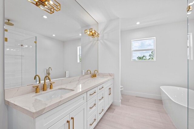 126 Auburn Dr, Lake Worth Beach, FL 33460 - bathroom featuring recessed lighting, double vanity, a wealth of natural light, and a sink
