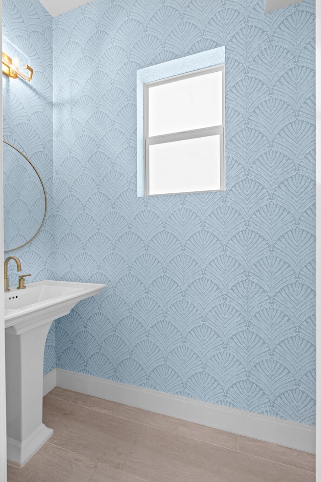 126 Auburn Dr, Lake Worth Beach, FL 33460 - bathroom with baseboards, wallpapered walls, and wood finished floors