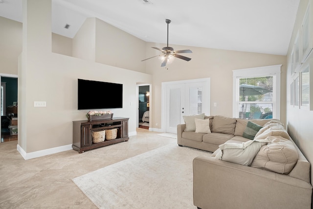 living area featuring visible vents, baseboards, ceiling fan, and high vaulted ceiling