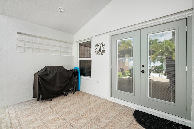 doorway to property with stucco siding and french doors