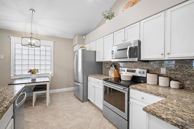 kitchen with an inviting chandelier, stainless steel appliances, tasteful backsplash, and white cabinets
