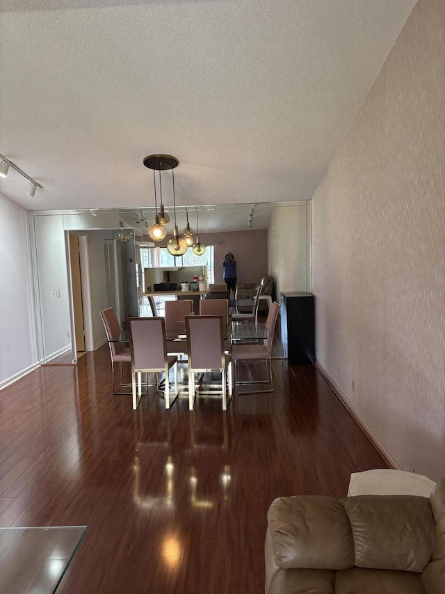 10137 Mangrove Dr Unit 203, Boynton Beach, FL 33437 - dining space featuring a textured ceiling and wood finished floors