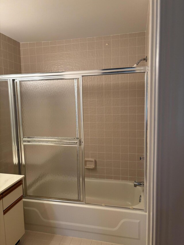 10137 Mangrove Dr Unit 203, Boynton Beach, FL 33437 - bathroom with tile patterned flooring, vanity, and shower / bath combination with glass door