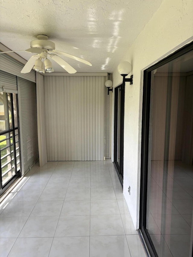 10137 Mangrove Dr Unit 203, Boynton Beach, FL 33437 - unfurnished room with a textured ceiling, a ceiling fan, and light tile patterned floors