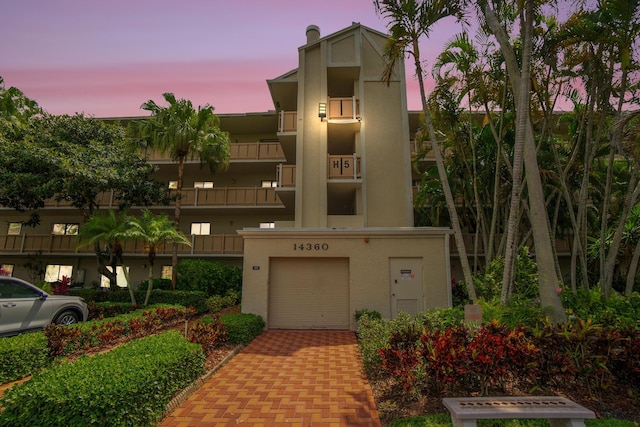 14360 Strathmore Ln Unit 404, Delray Beach, FL 33446 - view of building exterior with an attached garage