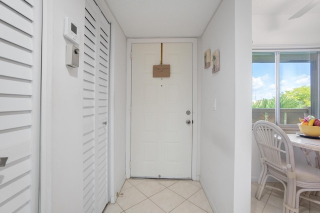 14360 Strathmore Ln Unit 404, Delray Beach, FL 33446 - entryway with light tile patterned flooring and baseboards