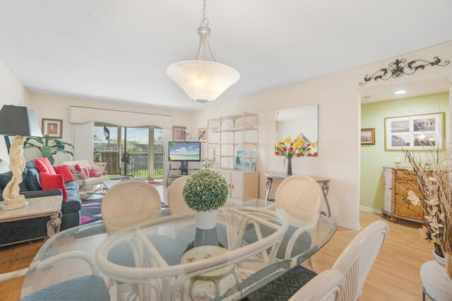 14360 Strathmore Ln Unit 404, Delray Beach, FL 33446 - dining space featuring wood finished floors and baseboards
