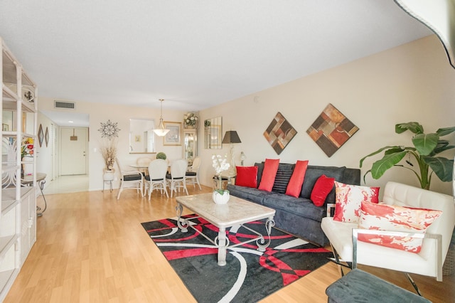 14360 Strathmore Ln Unit 404, Delray Beach, FL 33446 - living room featuring visible vents and wood finished floors
