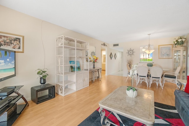 14360 Strathmore Ln Unit 404, Delray Beach, FL 33446 - living area featuring visible vents and wood finished floors