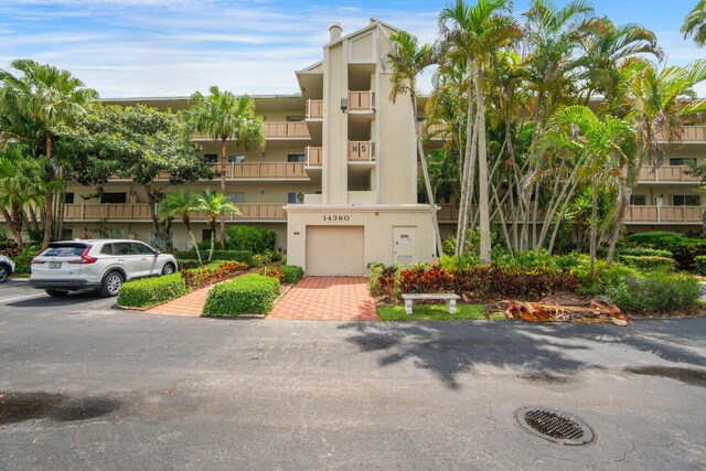 14360 Strathmore Ln Unit 404, Delray Beach, FL 33446 - view of property featuring an attached garage and decorative driveway