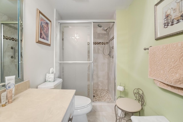 14360 Strathmore Ln Unit 404, Delray Beach, FL 33446 - bathroom with vanity, toilet, and a shower stall
