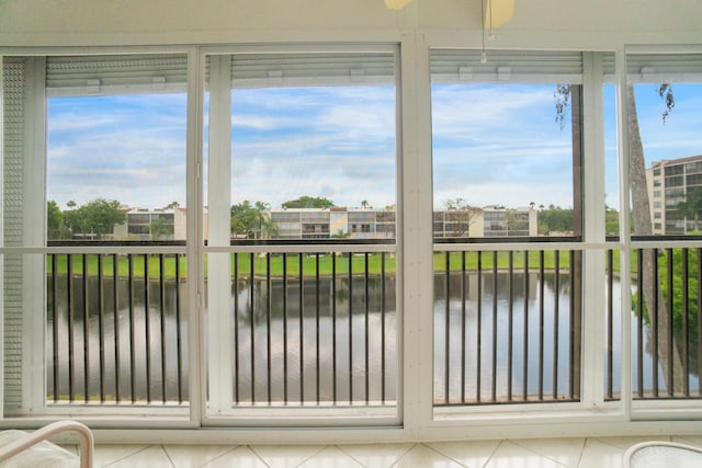 14360 Strathmore Ln Unit 404, Delray Beach, FL 33446 - unfurnished sunroom featuring a water view