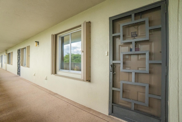 14360 Strathmore Ln Unit 404, Delray Beach, FL 33446 - view of exterior entry with stucco siding
