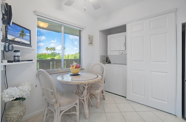 14360 Strathmore Ln Unit 404, Delray Beach, FL 33446 - dining space with stacked washer and clothes dryer, light tile patterned floors, and ceiling fan