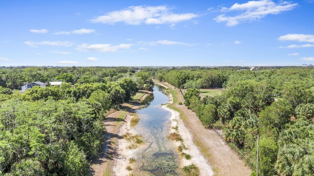 2924 Deer Run Trl, Loxahatchee, FL 33470 - drone / aerial view of a forest and a nearby body of water