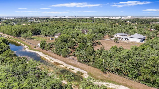 2924 Deer Run Trl, Loxahatchee, FL 33470 - bird's eye view of a forest and a nearby body of water