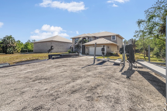 2924 Deer Run Trl, Loxahatchee, FL 33470 - view of front of property with an attached garage