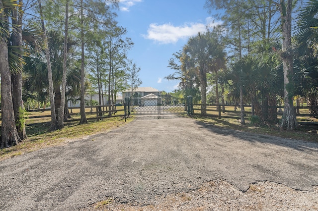 2924 Deer Run Trl, Loxahatchee, FL 33470 - view of street with a gate and a gated entry