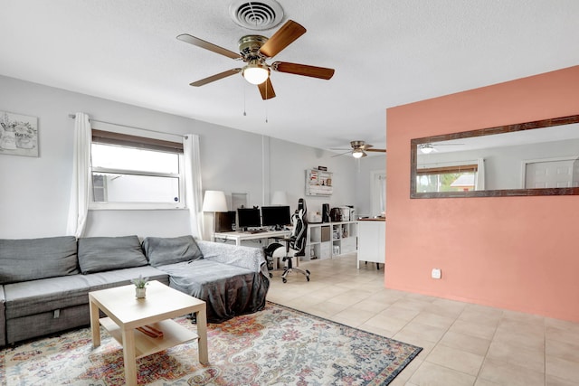 4902 NW 27th Way, Tamarac, FL 33309 - living area with ceiling fan, light tile patterned flooring, a textured ceiling, and a desk