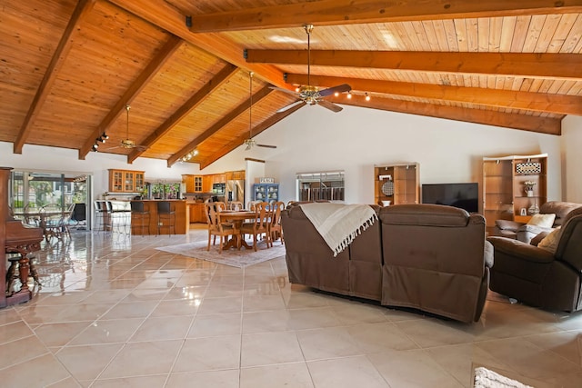 650 NW 48th Ave, Coconut Creek, FL 33063 - living area with a ceiling fan, lofted ceiling with beams, light tile patterned floors, and wood ceiling