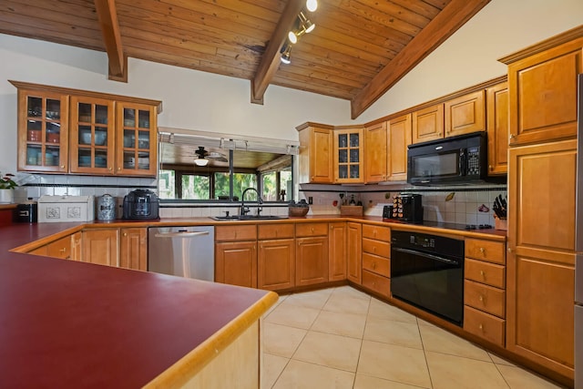 650 NW 48th Ave, Coconut Creek, FL 33063 - kitchen with rail lighting, wooden ceiling, black appliances, and a sink