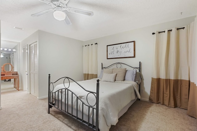 650 NW 48th Ave, Coconut Creek, FL 33063 - bedroom featuring ceiling fan, light carpet, a textured ceiling, and a closet