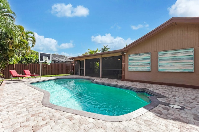 650 NW 48th Ave, Coconut Creek, FL 33063 - view of swimming pool featuring a patio area, a sunroom, a fenced in pool, and fence