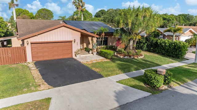 650 NW 48th Ave, Coconut Creek, FL 33063 - single story home featuring roof with shingles, driveway, a garage, roof mounted solar panels, and a front lawn