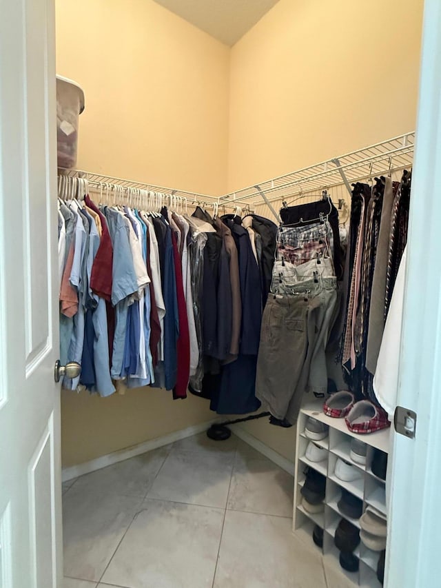 spacious closet featuring tile patterned floors