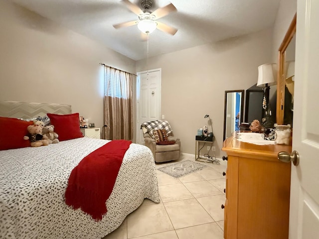 bedroom with light tile patterned floors and a ceiling fan