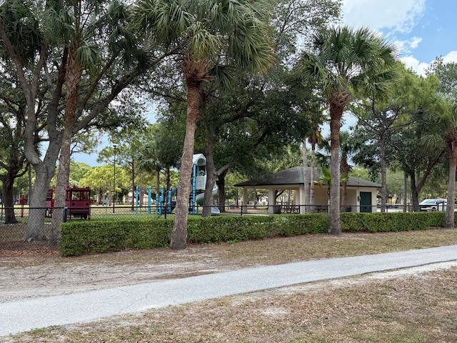 view of home's community with a gazebo, fence, and playground community
