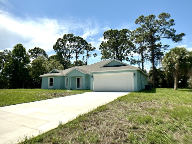 ranch-style home with an attached garage, concrete driveway, stucco siding, a front yard, and a shingled roof