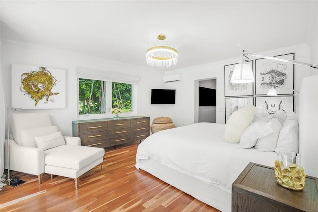6100 La Gorce Dr, Miami Beach, FL 33140 - bedroom featuring crown molding, a wall mounted air conditioner, wood finished floors, and a chandelier