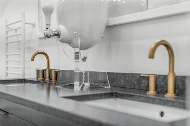 6100 La Gorce Dr, Miami Beach, FL 33140 - bathroom view of a sink and a towel warmer