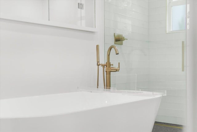 6100 La Gorce Dr, Miami Beach, FL 33140 - full bath with a freestanding bath, a tile shower, and a sink