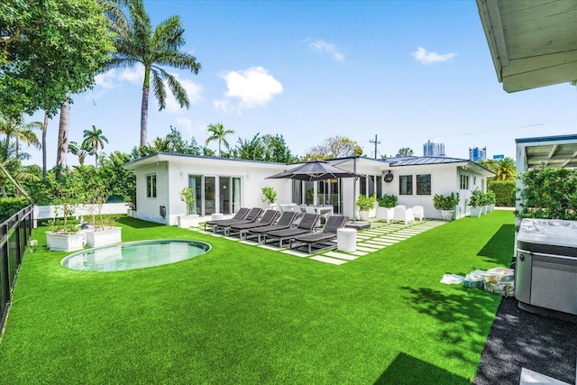 6100 La Gorce Dr, Miami Beach, FL 33140 - back of property featuring stucco siding, an outdoor pool, a standing seam roof, and a patio